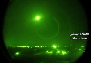 An image grab from a video released on May 10, 2018 by the "Central War Media" and broadcast on Syria's official TV purportedly shows Syrian air defense systems intercepting Israeli missiles over Syrian airspace. (photo credit: AFP PHOTO / HO / CENTRAL WAR MEDIA)